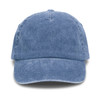 A vintage washed blue cap with a curved brim and a textured finish. Features a logo on the front.