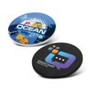 Two circular coasters featuring vibrant designs: one blue with an ocean theme and the other black with a logo.