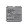 A grey, silicone 4-section dog enrichment lick mat with various textured patterns and a heart-shaped hole.