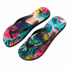 Colourful rubber thongs featuring a tropical leaf design with black straps and branding on the side.