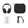 Black wireless headphones along with a carrying case, a user manual, and a charging cable.