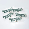 A collection of green and white stickers featuring a playful logo and branding for "Smash Burger."
