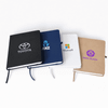 A set of four A5 smart notebooks in black, blue, white, and brown, each featuring a logo on the cover.