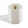 A white hexagonal ceramic candle with a wooden wick placed inside. It has a minimalist design.