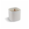 A premium square glass candle in white, featuring a wood wick. It has a smooth, minimalist design and a logo.