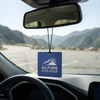 A blue car air freshener hanging from a rearview mirror, featuring a logo and set against a mountain backdrop.