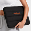 A black neoprene laptop sleeve with a padded design, featuring an a logo on the front. Suitable for a 14-inch laptop.