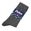 A pair of grey seamless socks with a branded label featuring a colourful design on the band.
