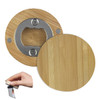 A drink bottle opener featuring a bamboo exterior and a stainless steel opening mechanism, accompanied by a hand holding it.