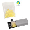 A grey car air freshener with a compartment for yellow gel beads, alongside a bag of additional gel beads.