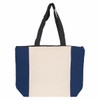 A large tote bag featuring a cream body with navy blue side panels and black handles. It has a zip closure and a logo.