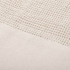 A textured beige mesh fabric, featuring a woven pattern at the top and a solid section at the bottom.