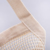 A beige mesh tote bag with sturdy fabric straps, featuring a textured woven design and a simple logo.