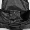 A black duffle bag interior with a zipped pocket and spacious main compartment. It features a logo.