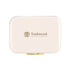 A cream-coloured cooler with a gold clasp and a logo. The design features a rectangular shape.