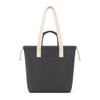 A dark grey tote bag with cream handles and a front pocket, featuring a drawstring closure.