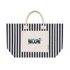 A striped tote bag in navy and cream with a front pocket and a branded logo.