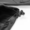 A close-up of a black windbreaker featuring an adjustable drawstring toggle.