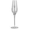 A clear glass champagne flute with a tall, slender design and a circular base, featuring a logo.