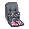 A grey picnic backpack with utensils, glasses, and plates neatly organised inside.