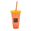 A drink bottle in orange plastic with a yellow lid and straw, featuring a logo. Ideal for beverages.