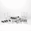 A picnic set features white-handled cutlery, glass tumblers, and serving platters on a white background.