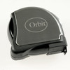 A black tape measure with a metallic finish and a logo on top. It has a compact design for easy handling.