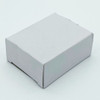 A small white cardboard box with a plain design, likely containing dental floss products.