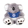 A grey plush koala with white ears and paws, wearing a blue shirt featuring a logo.