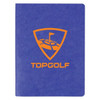 A blue notebook with a textured cover featuring an orange logo and branding. It has blank pages inside.