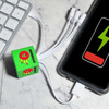 A green Cube Topper PVC cable connected to a phone and a computer, with multiple charging connectors.