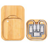 A bamboo charging set featuring multiple cables in gray compartments, presented in a natural wood holder.