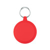 A bright red circular keychain with a silver ring for attachment.
