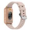 A slim smart watch in rose gold with a light pink strap, featuring a logo and sensors on the back.
