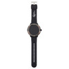 A black smart watch with a round face and adjustable strap, featuring a logo on the dial.