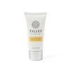 A hand and nail cream tube in white and silver, featuring a floral logo and a yellow label.