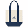 A mini canvas tote in cream and navy blue, featuring a logo on the front and sturdy handles.