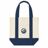 A mini canvas tote in cream and navy blue, featuring a circular logo with wave design.