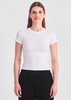 A white women's baby tee with short sleeves, paired with black pants, displayed against a plain background.