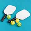 A pickleball set featuring two white paddles and three balls in yellow and green on a blue background.