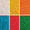 A collection of brightly coloured chewy fruit candies in six sections: white, yellow, orange, red, blue, and green.