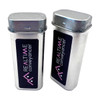 A silver tin with a hinged lid, featuring a black label and logo, showcasing a sleek, modern design.
