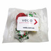 A cello bag filled with assorted Christmas chocolates in festive foil wrappers, including red, silver, and gold.
