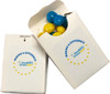 A white cardboard box with a blue and yellow chewy fruit inside, featuring a logo on the front.