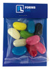 A clear bag containing assorted jelly beans in vibrant colours including pink, blue, yellow, and black, with a branded backing.