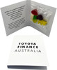 A gift card packet featuring a selection of colourful mixed lollies, enclosed in a white folder with branding.