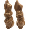 A brown chocolate Easter bunny figurine with exaggerated features, presented in pairs.