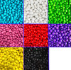 A grid of colourful chocolate beans in blue, white, green, pink, red, purple, yellow, black, and a blank section.