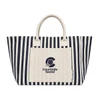 A striped tote bag in navy blue and cream featuring a logo on the front and sturdy handles.