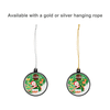 Two decorative hanging balls, one with a silver rope and the other with a gold rope, featuring a festive Christmas design.